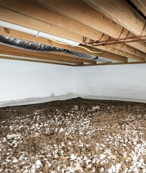 a crawl space that was repaired with a lot of rocks on the floor