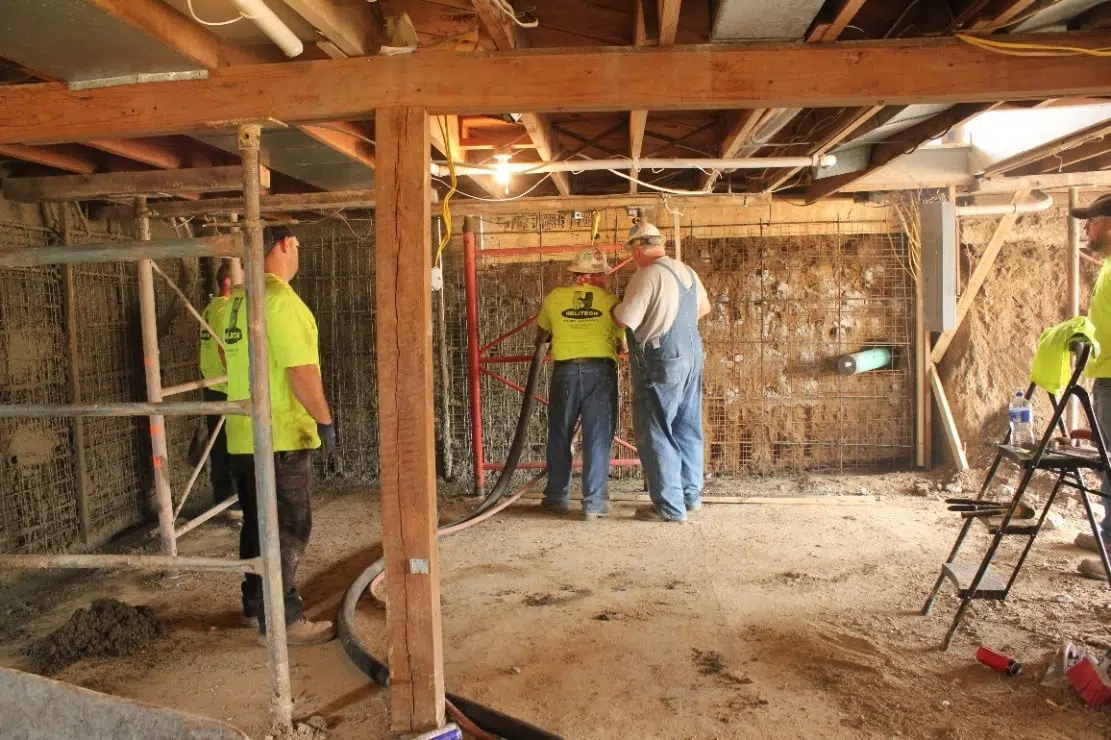 team fixing foundation for home