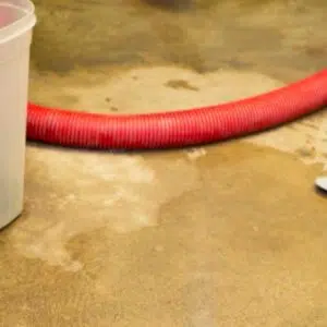 water in basement with red pipe