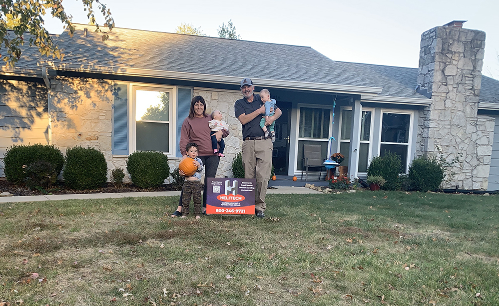 Family standing outside their home